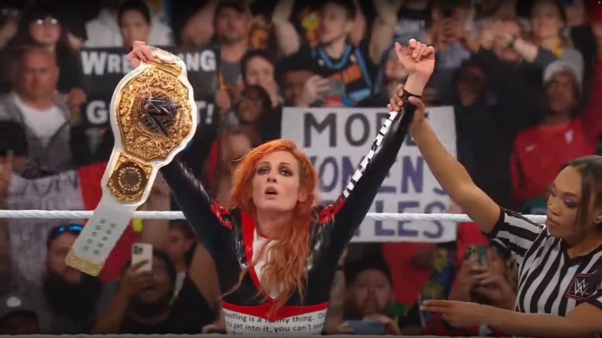 Becky Lynch celebrates winning the Women's World Championship on WWE Raw